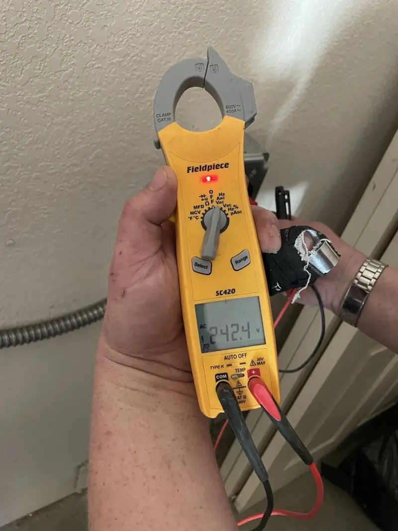 Voltage testing with clamp meter during Electrical Installation Services in East Bloomfield